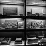 베트남 전쟁 박물관 - A detailed museum exhibit showcasing the Vietnam War with rare black-and-white photographs and origi...